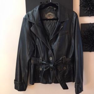 Black faux leather jacket with aged detailing.